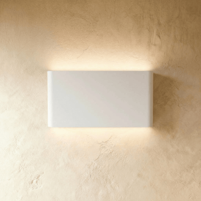 Femi Wall Lamp by Residence Supply featuring a sleek modern design with a white shade and wall-mounted fixture.