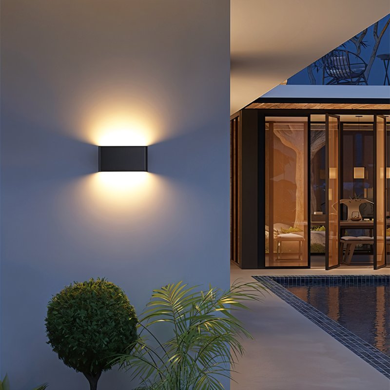 Femi Wall Lamp by Residence Supply, modern wall-mounted light fixture with sleek design and metallic finish.