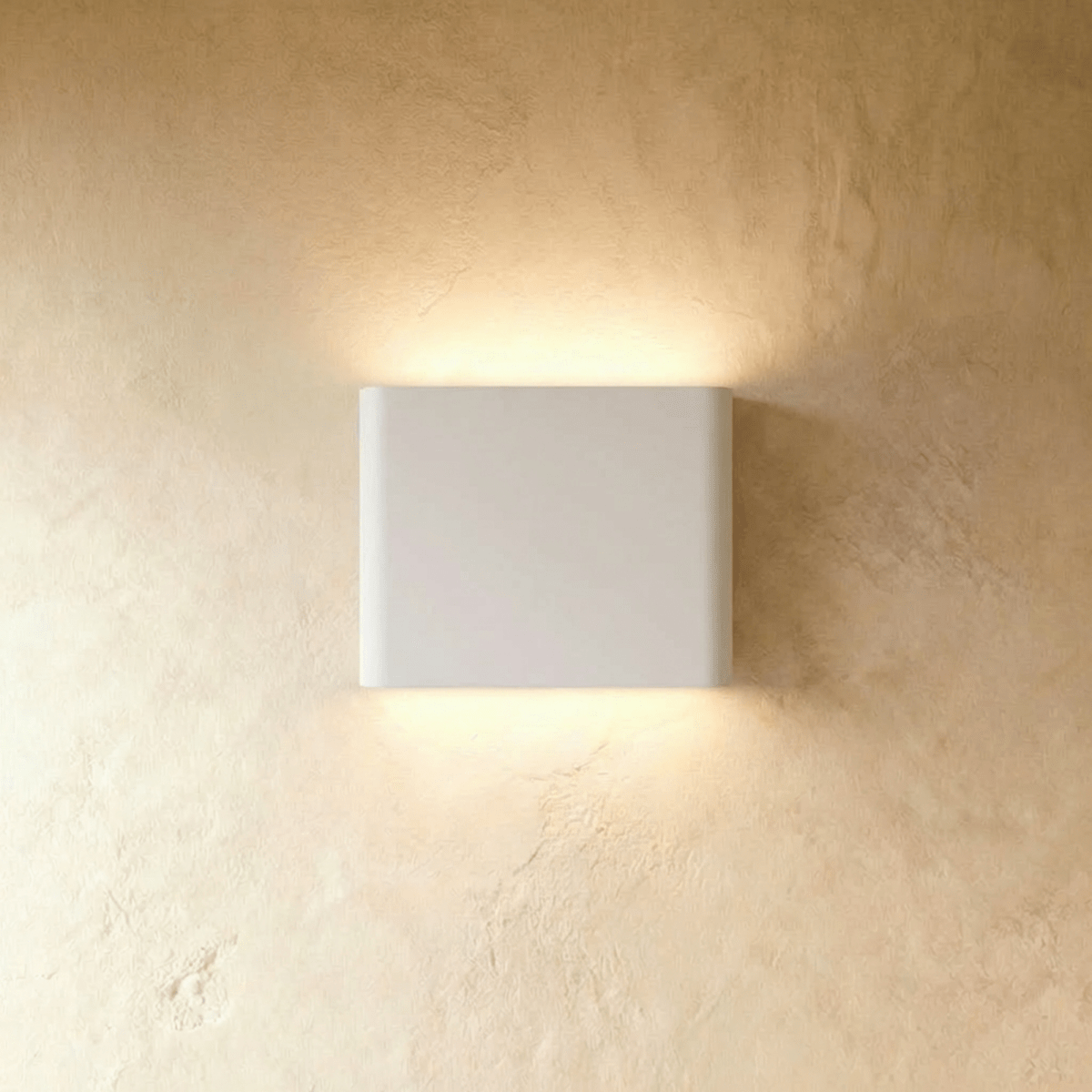 Femi Wall Lamp by Residence Supply featuring modern design with sleek metal finish and adjustable arm for ambient lighting.