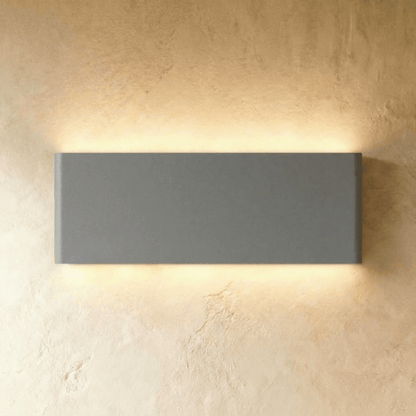 Femi Wall Lamp by Residence Supply, modern wall-mounted light fixture with sleek design and adjustable arm, ideal for contemporary interiors.