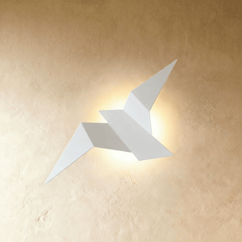 Residence Supply Finch Wall Lamp mounted on a wall with a sleek, modern design and a black finish, providing stylish ambient lighting.