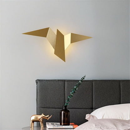 Residence Supply Finch Wall Lamp mounted on a wall with a sleek metal finish and modern design for stylish interior lighting.
