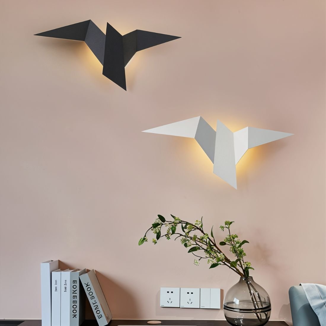Residence Supply Finch Wall Lamp mounted on a wall with a sleek, modern design and metal finish.