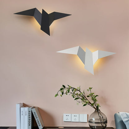 Residence Supply Finch Wall Lamp mounted on a wall with a sleek, modern design and metal finish.