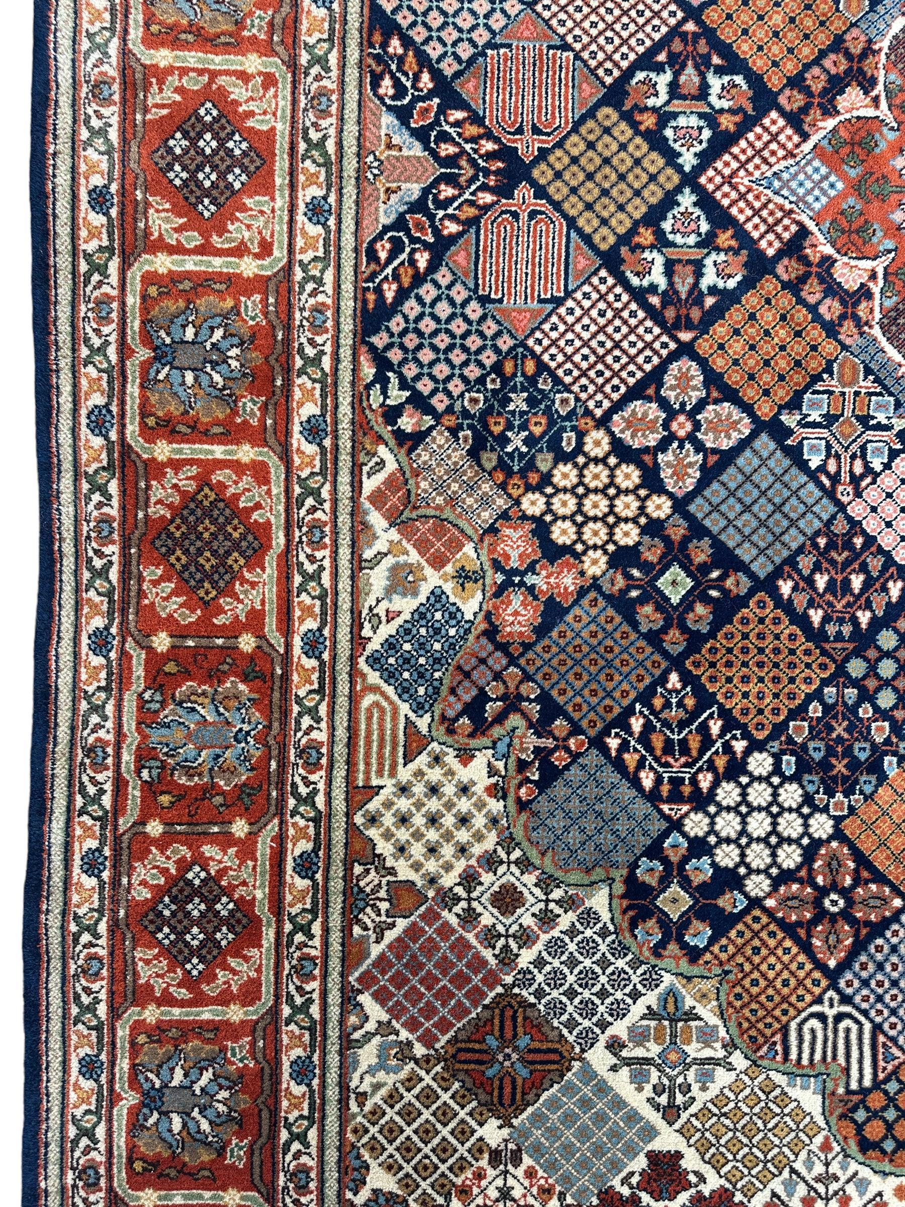 Hand-Knotted Indo-Joshegan Wool Rug – 12'2" x 9'1" – Geometric Medallion Design, Rich Warm Palette - Nuvé