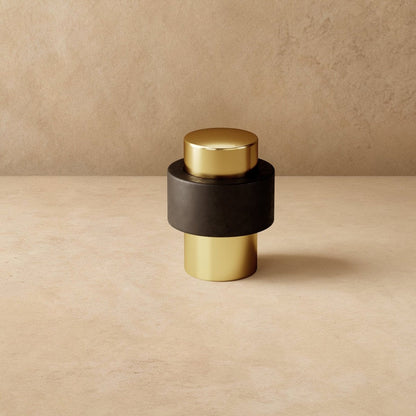 Residence Supply Finio door stop mounted on a door to prevent movement, made of durable material for home and garden use.