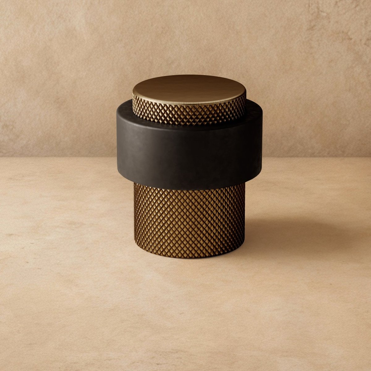Residence Supply Finio door stop mounted on a wall, made of durable metal for preventing door damage in home and garden settings.