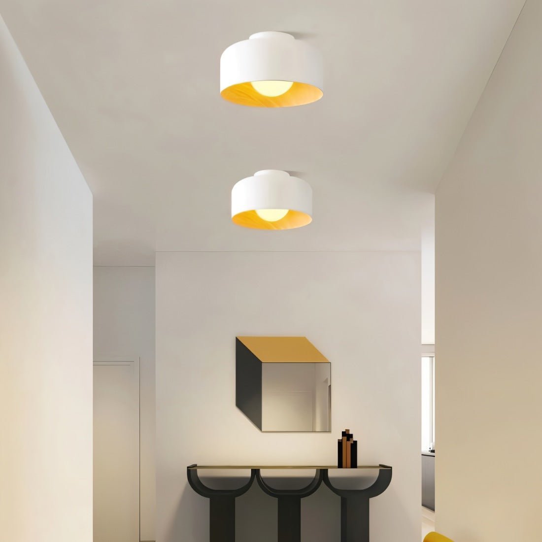 Residence Supply Folkio ceiling light fixture with modern design, featuring a sleek, round shape and warm LED illumination.