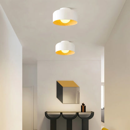 Residence Supply Folkio ceiling light fixture with modern design, featuring a sleek, round shape and warm LED illumination.