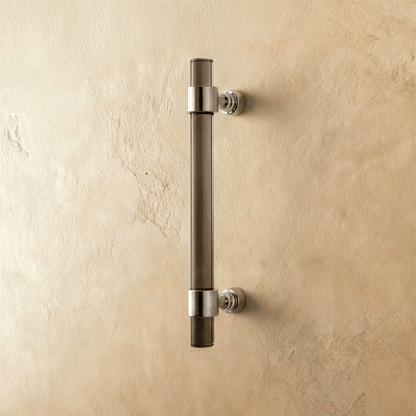 A clear image of a Frada acrylic knob and pull bar for cabinets, featuring sleek, transparent design from Residence Supply.