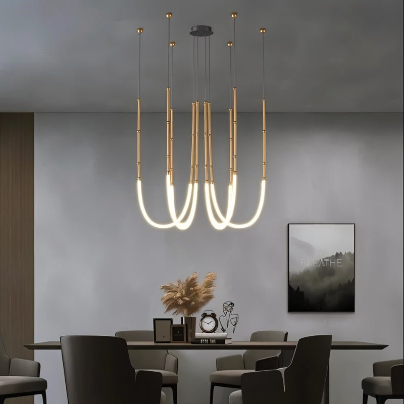 Elegant Francesca Chandelier by Residence Supply with multiple glass orbs and metal framework, hanging from a ceiling.
