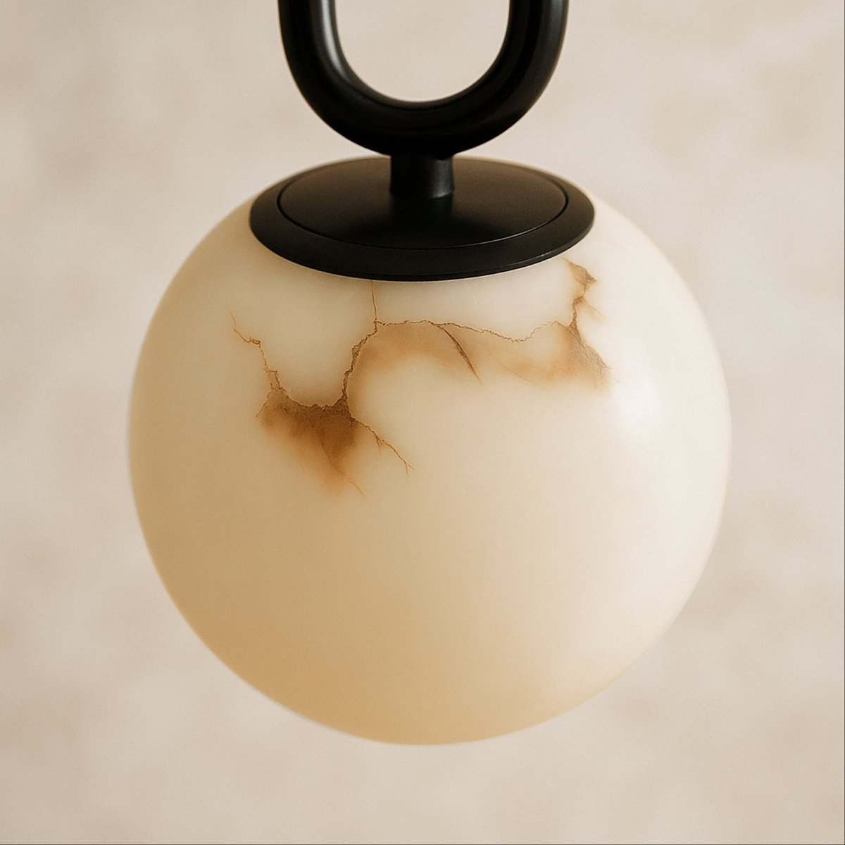 Alabaster pendant light by Residence Supply featuring a smooth, rounded gong shape hanging from a ceiling mount.