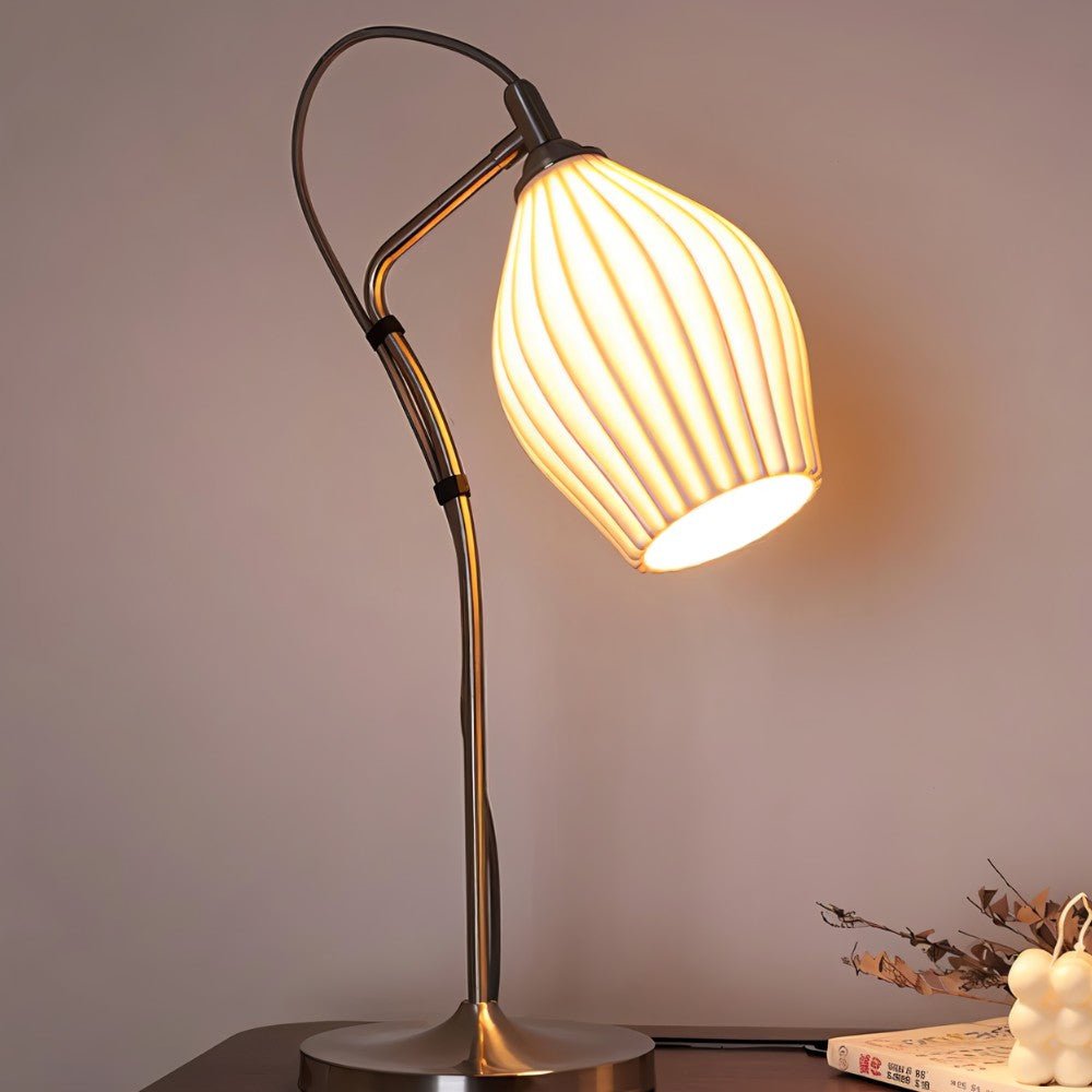 Haela table lamp by Residence Supply with a sleek modern design and a neutral-colored fabric lampshade.