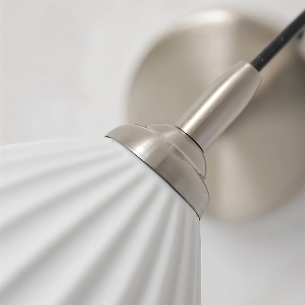 Modern Haela Wall Lamp by Residence Supply featuring a sleek design with a curved metal arm and a round shade for stylish lighting.