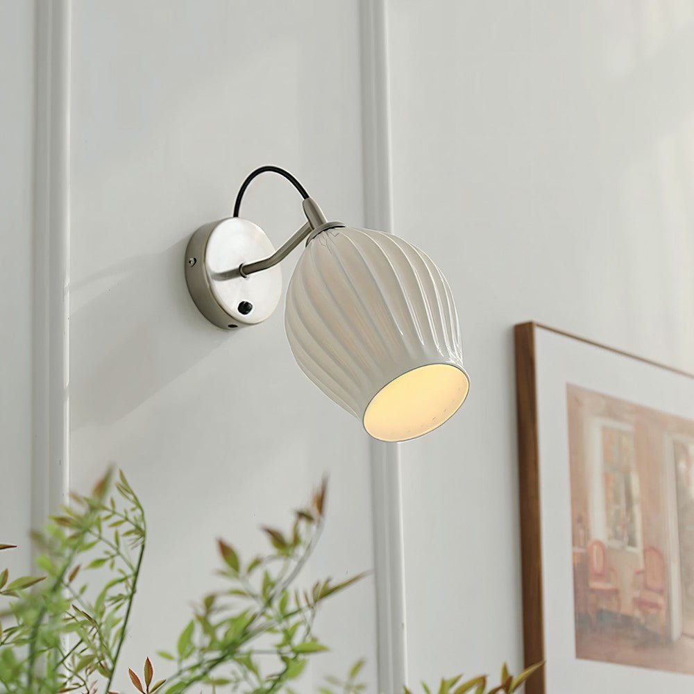 Modern Haela Wall Lamp by Residence Supply featuring sleek design and warm lighting for stylish interior decor.