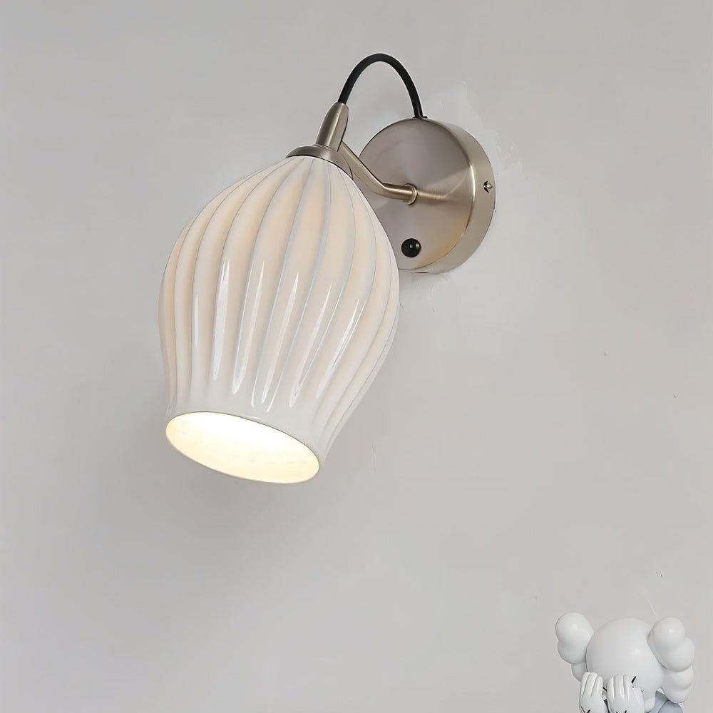 Modern Haela Wall Lamp by Residence Supply, featuring sleek design and metal finish for stylish indoor lighting.