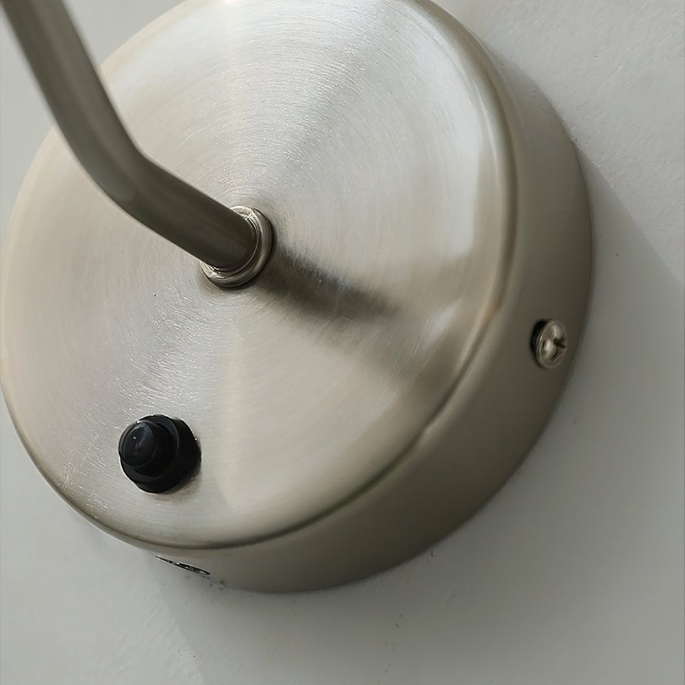 Modern Haela Wall Lamp by Residence Supply, featuring a sleek design with a metal finish and a downward-facing light.