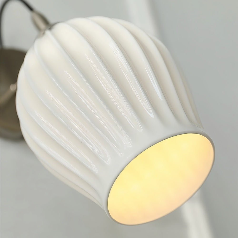 Haela wall lamp by Residence Supply, featuring a modern design with a sleek metal finish and a wall-mounted light fixture.