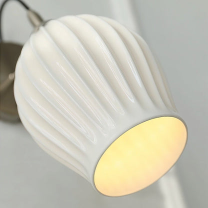 Haela wall lamp by Residence Supply, featuring a modern design with a sleek metal finish and a wall-mounted light fixture.