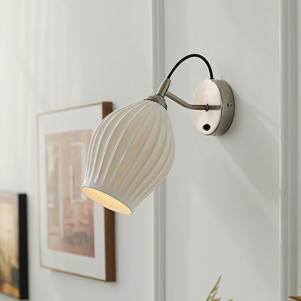 Modern Haela Wall Lamp by Residence Supply featuring a sleek metal finish and a minimalist design for stylish wall lighting.