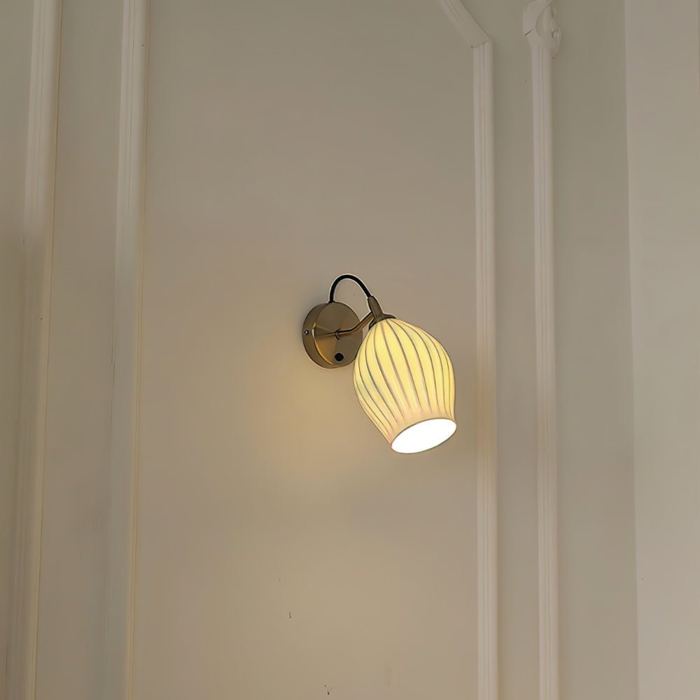 Modern Haela Wall Lamp by Residence Supply with sleek metal finish and adjustable arm, mounted on a neutral wall.