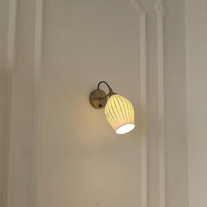 Modern Haela Wall Lamp by Residence Supply with sleek metal finish and adjustable arm, mounted on a neutral wall.