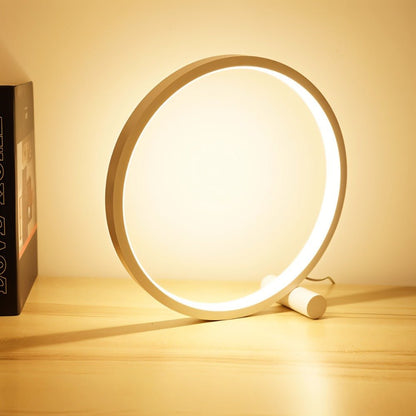 Residence Supply Halo Touch Table Lamp with modern design and touch control, shown on a bedside table in a cozy room setting.