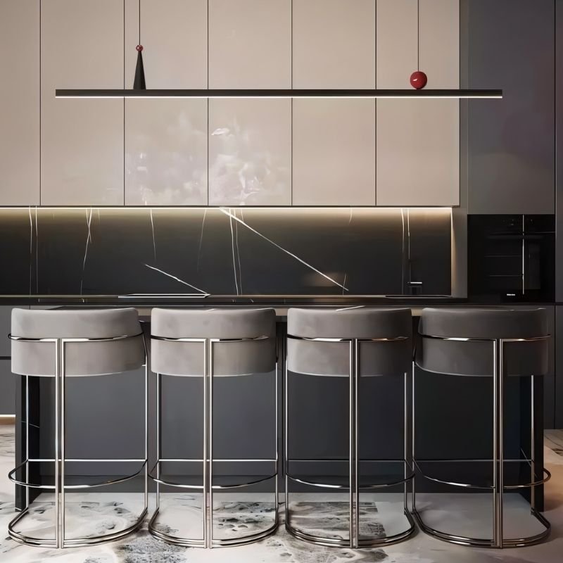 Residence Supply Halrya pendant light hanging above a kitchen island, featuring a modern design with sleek metal finish.