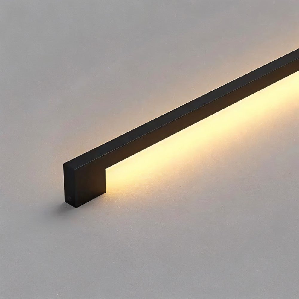 Residence Supply Hanur wall lamp with modern design, featuring a sleek metal finish and ambient lighting for contemporary decor.