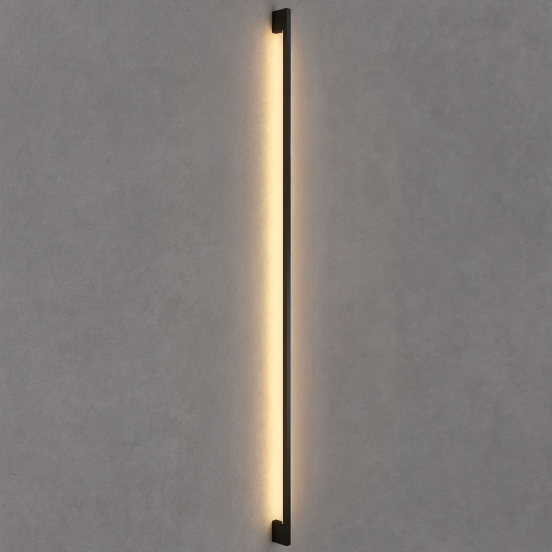 Modern Hanur Wall Lamp by Residence Supply featuring a sleek metal design and warm lighting for contemporary interiors.