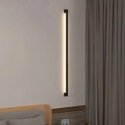 Residence Supply Hanur Wall Lamp showing modern design with a sleek metal finish and wall mounting bracket.