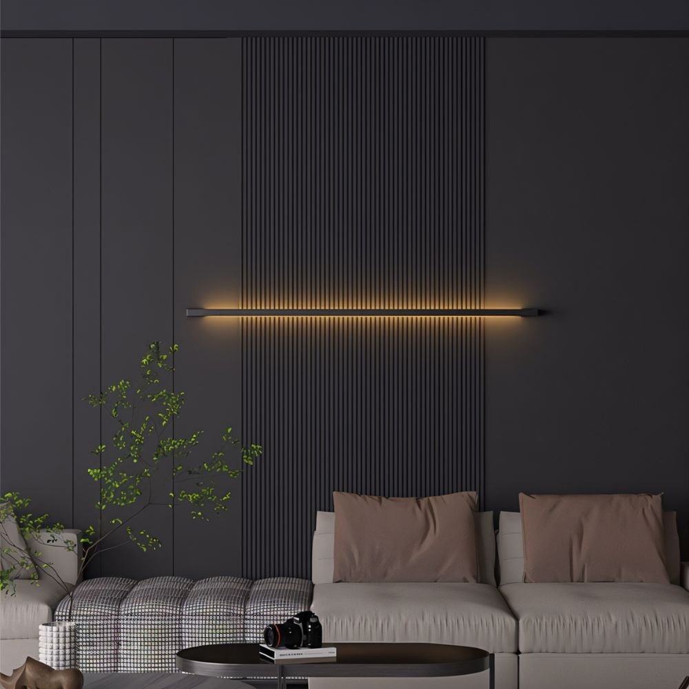 Hanur wall lamp by Residence Supply featuring a modern design with a sleek metal finish and adjustable arm for versatile lighting.