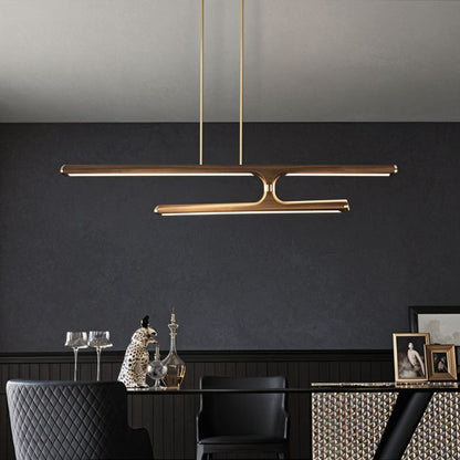 Harbin Pendant Light by Residence Supply hanging with a sleek metal fixture and clear glass shade in a modern interior setting.