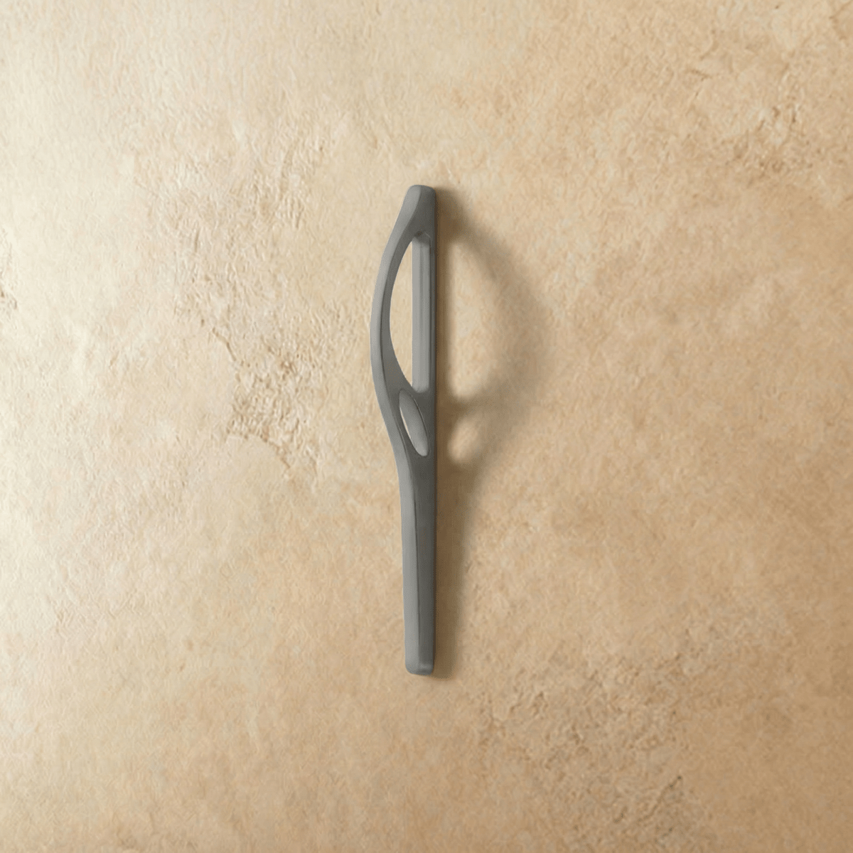 Residue Supply Hazis Pull Bar in black, a sleek cabinet handle for home and garden furniture, mounted on a cabinet door.