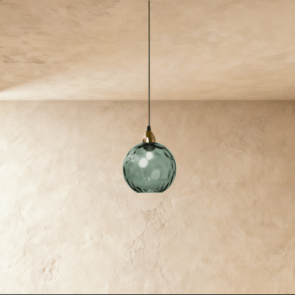 Modern Hea Pendant Light by Residence Supply hanging from ceiling with a sleek metal shade and adjustable cord.