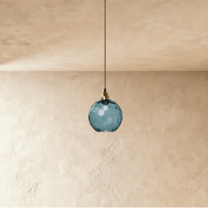 Modern Hea Pendant Light by Residence Supply with a sleek metal fixture and clear glass shade, perfect for contemporary interior decor.