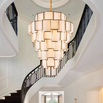 Hiraj chandelier by Residence Supply featuring a modern design with multiple glass globe lights hanging from a sleek metal frame.