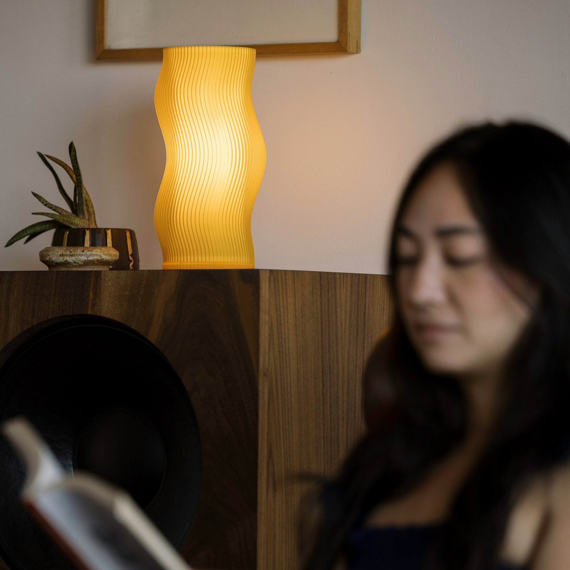 Terra Labs Woogie Table Lamp with a warm honey-colored ceramic base and a simple fabric shade, ideal for modern decor.