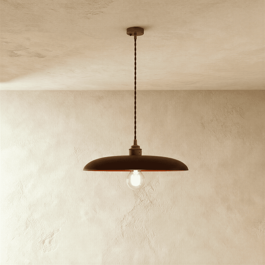 Hreta Pendant Light by Residence Supply hanging from ceiling with a modern design and warm lighting effect.