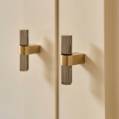 Hyle knob and pull bar from Residence Supply, modern cabinet hardware in a sleek metallic finish, mounted on a cabinet.