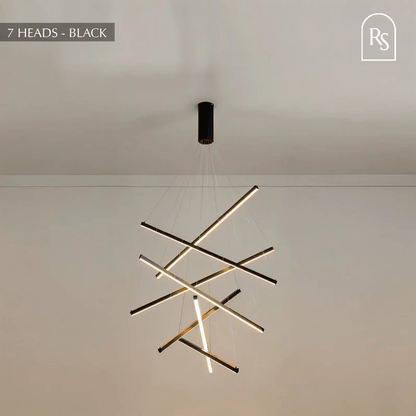 Ilona chandelier by Residence Supply featuring a modern design with multiple hanging glass orbs and a sleek metal frame.
