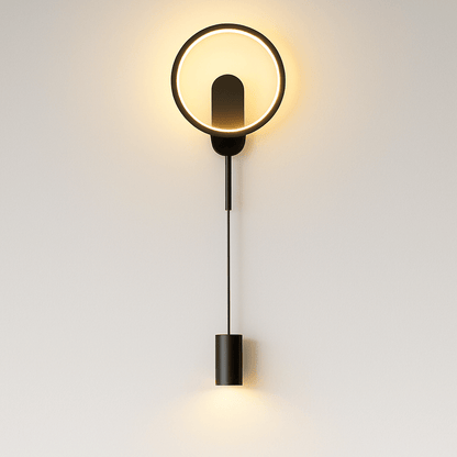 Imrat wall lamp by Residence Supply featuring a modern design with a sleek metal finish and adjustable arm for versatile lighting.