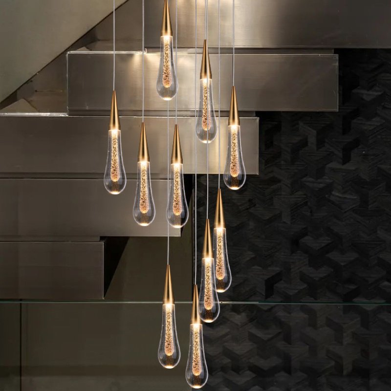 Drop Linear Chandelier by Residence Supply with sleek metal frame and multiple hanging light bulbs for modern interior lighting.