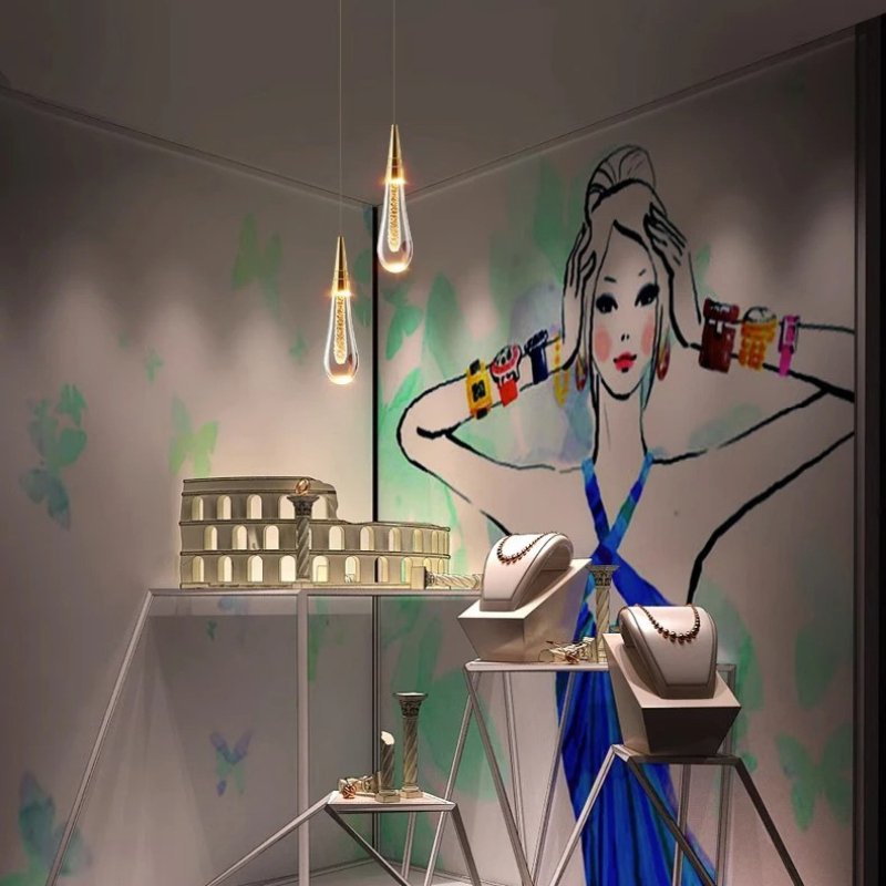 Drop Linear Chandelier by Residence Supply featuring sleek, modern metal design with multiple hanging light fixtures.
