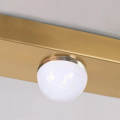 Drop Linear Chandelier by Residence Supply featuring sleek metal arms and multiple hanging light bulbs for modern decor.