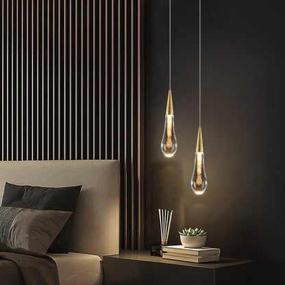 Drop Linear Chandelier by Residence Supply featuring sleek metal arms and modern lighting design with multiple hanging bulbs.