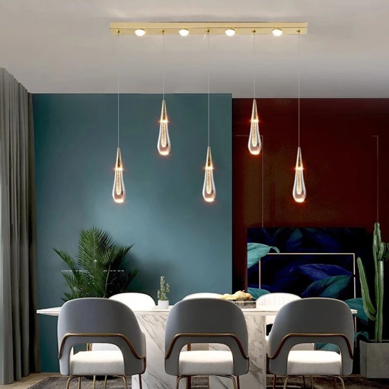 Drop Linear Chandelier by Residence Supply featuring sleek metal arms and multiple hanging light bulbs for modern interior lighting.