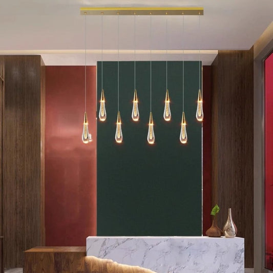 Drop Linear Chandelier by Residence Supply featuring sleek metal arms and multiple hanging light bulbs for modern interior decor.