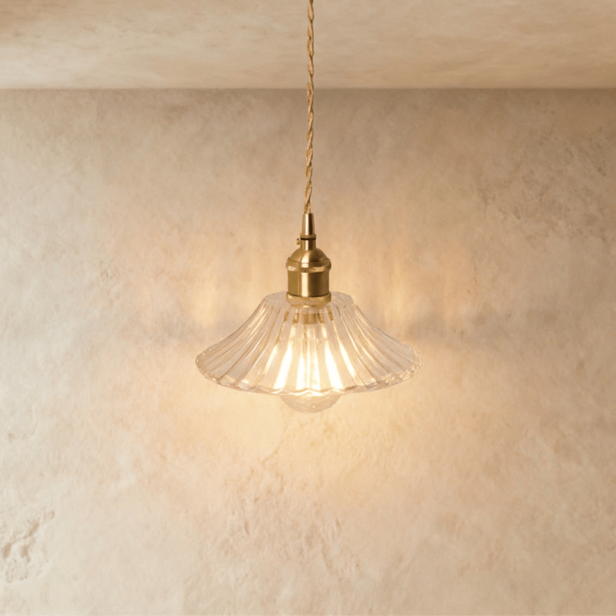 Residence Supply Isabel pendant light with a sleek metal fixture and clear glass shade hanging from a ceiling mount.
