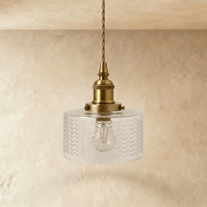Isabel Pendant Light by Residence Supply hanging from ceiling with a sleek modern design and a warm metallic finish.